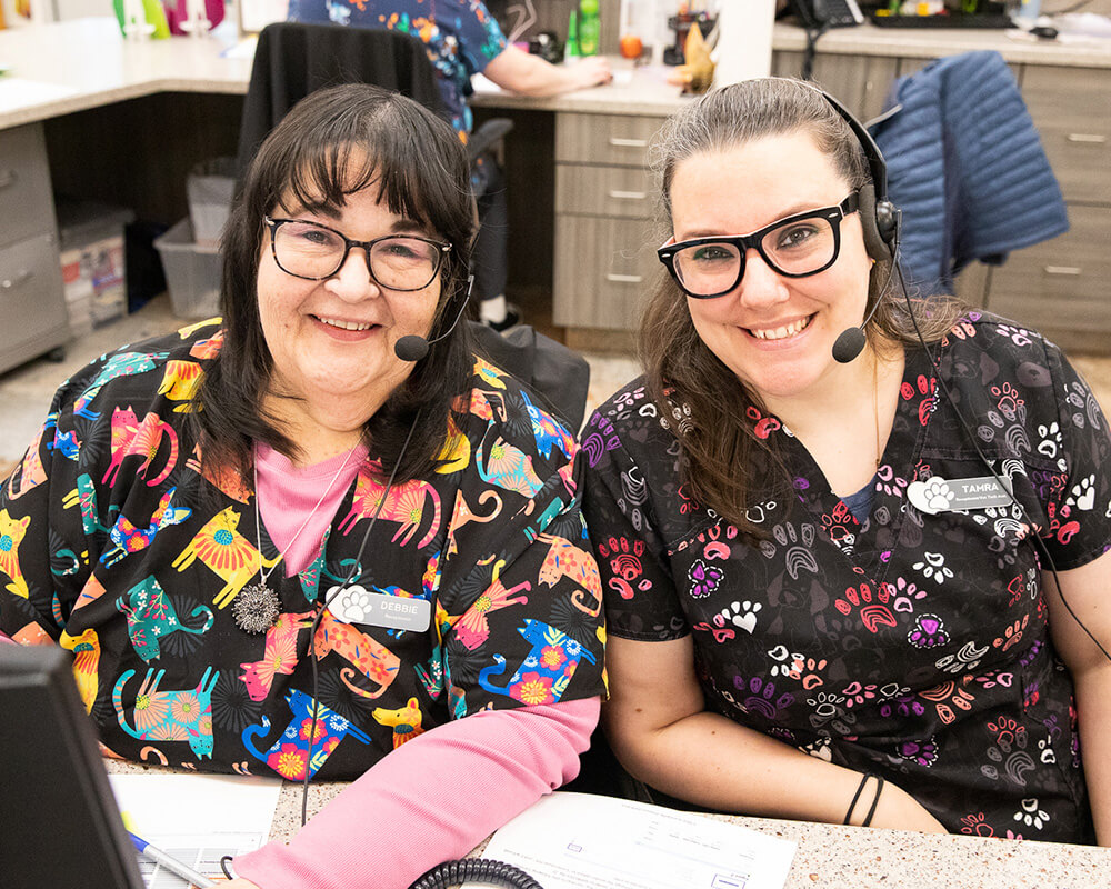 Friendly veterinary team members smiling together at Twin Cities Veterinary Clinic in Soldotna, Alaska