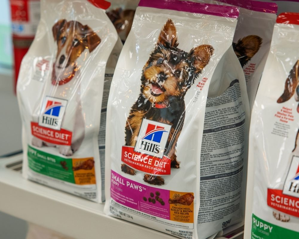 pet-food-product Bags of dog food are displayed on shelves
